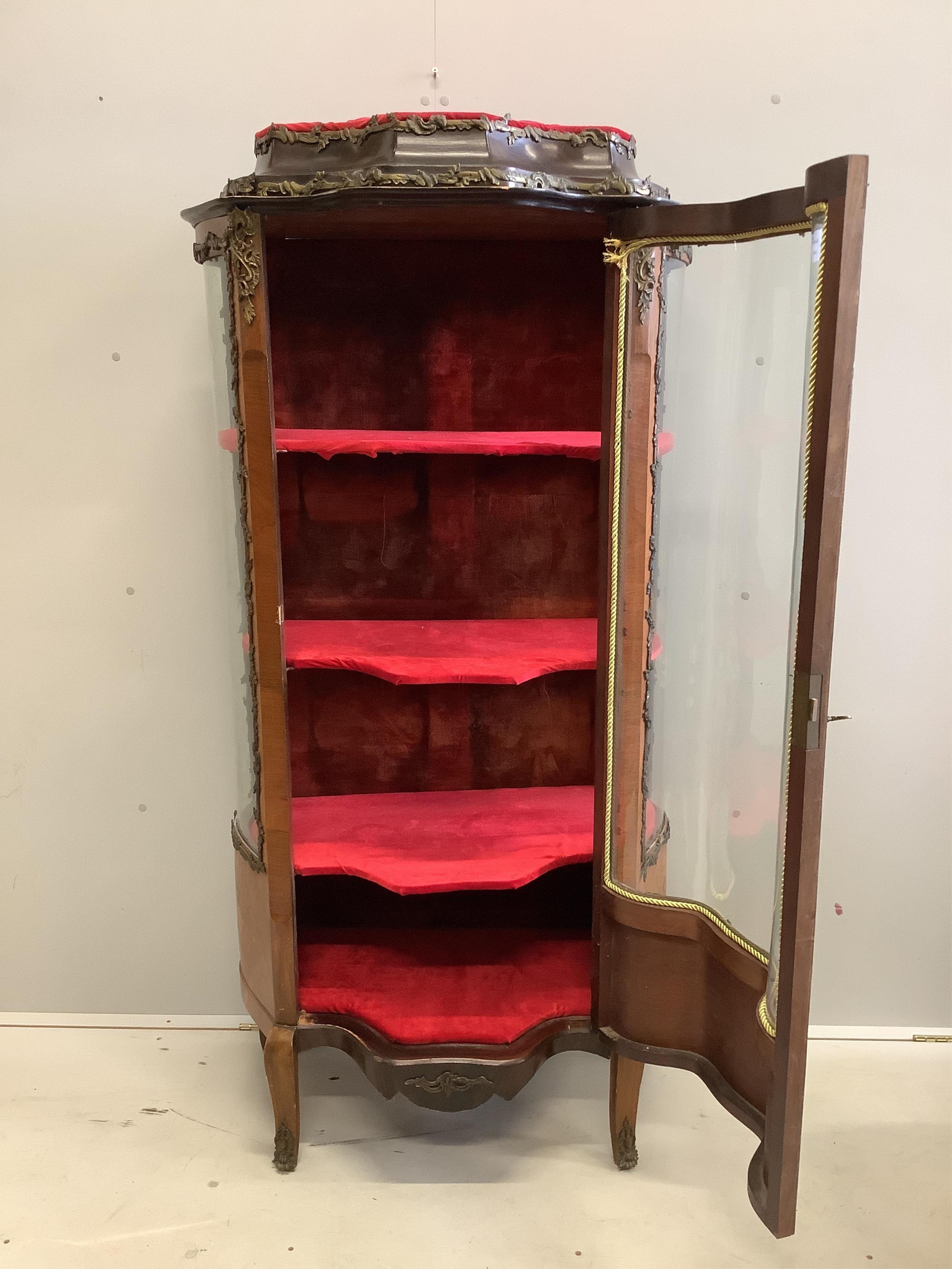 A gilt metal mounted and marquetry inlaid French kingwood vitrine, width 82cm, depth 47cm, height 165cm. Condition - fair